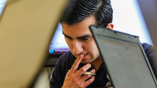 A contemplative faculty or staff member working with technology